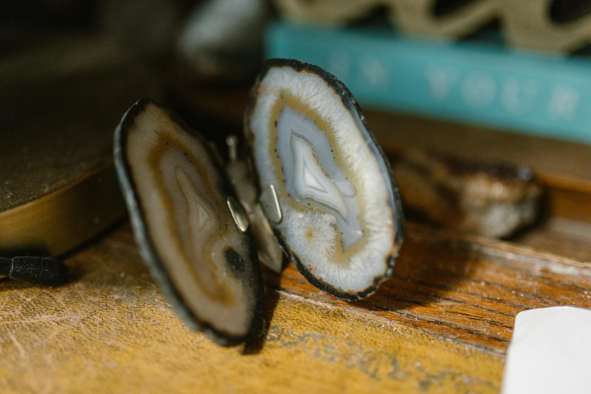 Detailed close-up of a geode bookend showcasing crystal patterns on a wooden table.
